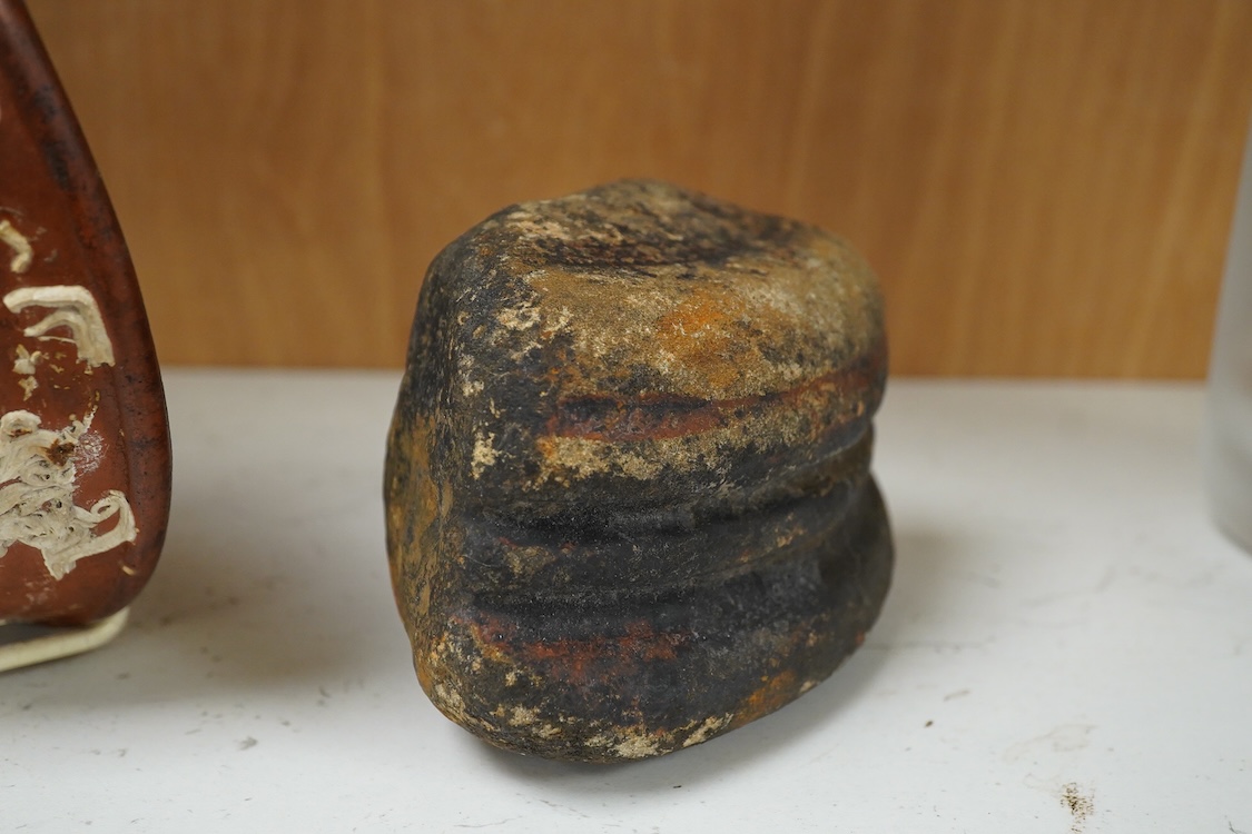 A Roman Samian ware bowl with provenance, allegedly from the Pan Rock shipwreck, together with an Iron Age Quern stone, largest 19cm in diameter